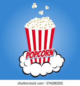 Popcorn in a striped cup on a blue background.