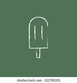 Popsicle hand drawn in chalk on a blackboard vector white icon isolated on a green background.