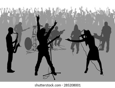 Popular music concert and crowd of fans silhouettes