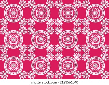 Porcelain flower bouquets and white diamonds surround a wheel. with dark red background.