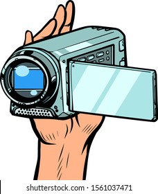 portable hand-held video camera. Pop art retro vector illustration kitsch vintage 50s 60s