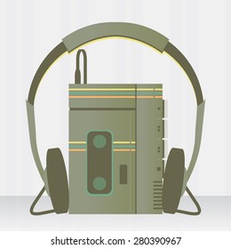 Portable music player vintage with headset over a gray background also know as walkman.