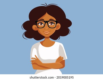 Portrait of an African Woman with Arms Crossed. Beautiful lady wearing spectacles standing and smiling
