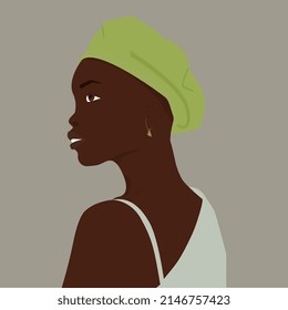 Portrait of an African woman in a green beret.