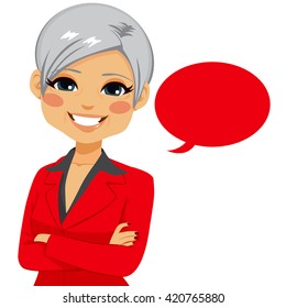 Portrait of an attractive senior confident businesswoman with red blank balloon isolated on white background