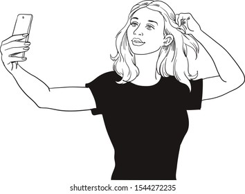 Portrait of a beautiful brunette girl on a gray background making a selfi with a smartphone