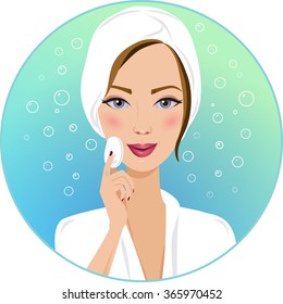 Portrait of a beautiful woman cleaning her face, surrounded by bubbles on a blue background. Smiling woman in a white bathrobe is caring for her face using a cotton pad and a facial skin care product