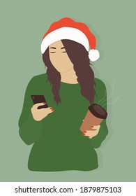 Portrait of a beautiful young girl wearing warm winter sweater and Santa hat holding a paper cup of coffee waiting for Christmas or New Year greetings in social networks and messengers
