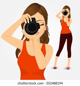 portrait of beautiful young photographer woman taking photos using her digital reflex camera