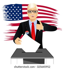 portrait of blonde man with glasses putting ballot in vote box and giving thumbs up on white background