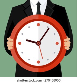 Portrait of a businessman holding a watch. Concept of time management