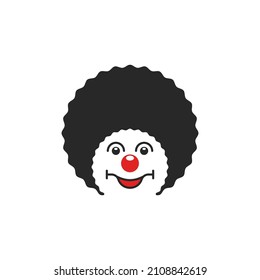 Portrait of a cheerful pendant logo, head of a circus comedian with a smile in a curly wig and a round red nose.