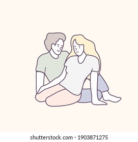 Portrait of a cheerful young couple hugging and looking at each other. 
Hand drawn style vector design illustrations.
