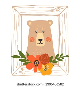 Portrait of a cute bear in a wooden frame. 