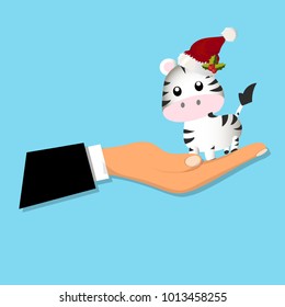 portrait of a cute zebra sitting on a hand. Zebra toy or character. Animals zoo collection. Christmas design