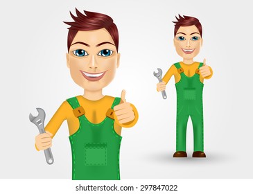 portrait of friendly young plumber dressed in green work clothes holding a wrench and giving thumbs up