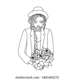 Portrait of a girl in a hat with a bouquet. 
