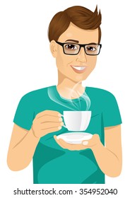 portrait of handsome young man drinking hot coffee or tea isolated on white background