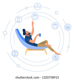Portrait of a happy young businessman working on virtual computer while sitting at the comfortable chair at home and drinks coffee