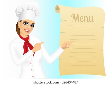 portrait of happy young female chef pointing at menu 