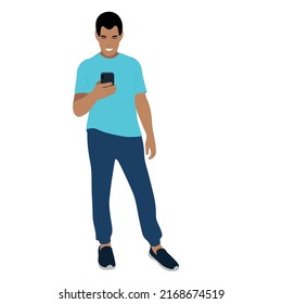 Portrait of a indian guy in full growth with a phone in his hand, vector isolated on a white background, the guy looks at the smartphone