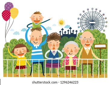 Portrait of large family in front of amusement park