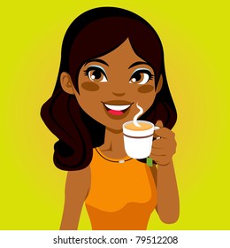 Portrait of a pretty African woman drinking a cup of herbal infusion