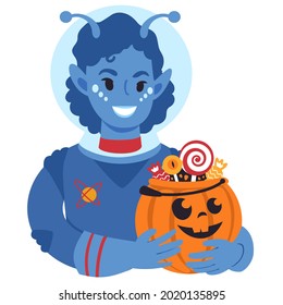 A portrait of a smiling girl in an alien costume holding up a carved halloween pumpkin bucket full of candy. Trick or treat tradition. Flat style vector illustration.