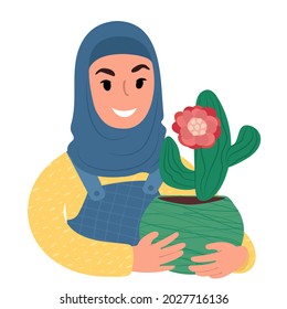 A portrait of a smiling girl in a hijab holding up a potted cactus with a bright red flower. Flat style vector illustration.