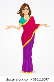 portrait of traditional indian woman showing something  isolated over white background