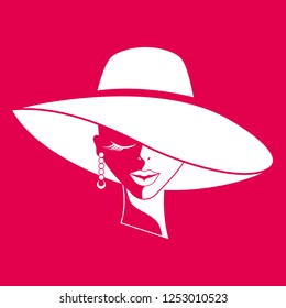 Portrait of woman in hat on red background