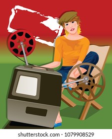Portrait of a woman sitting in front of a film projector
