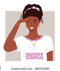 Portrait of young african woman with hairstyle, accessories looking forward. Smiling pretty black girl with golden earrings, necklace, ring on finger and bracelets. Happy afro female wearing t-shirt