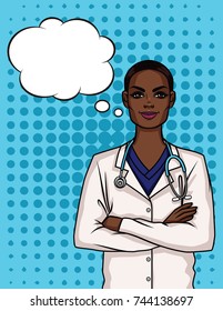 Portrait of a young Afro American female doctor in uniform. Happy woman doctor crossed her arms over her chest.