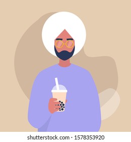 A portrait of a young indian male character holding a take away cup of bubble milk tea, lifestyle and food