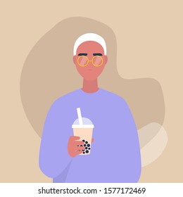 A portrait of a young male character holding a take away cup of bubble milk tea, lifestyle and food