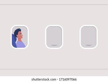 A portrait of a young male passenger in the illuminator frame, travel concept