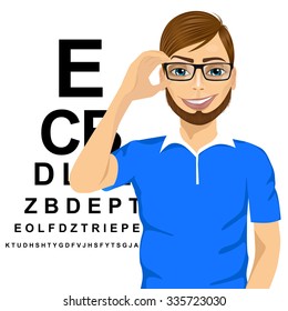 portrait of young man with glasses reading sight test characters a ophthalmologist