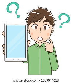 Portrait of a young man wearing a green shirt.He has a smartphone in his hand.And he wonders. Along with the question mark.