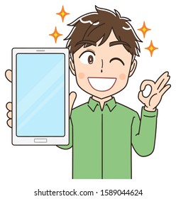 Portrait of a young man wearing a green shirt.He has a smartphone in his hand.And he is happy.And he shows the screen here.