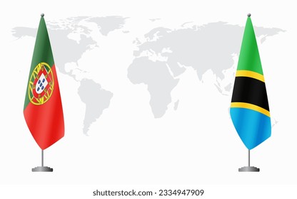 Portugal and Tanzania flags for official meeting against background of world map.
