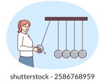 Positive business woman near Newton giant cradle symbolizing business management and employee motivation. Girl manager of corporation smiling working in personnel control department