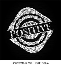 Positive chalkboard emblem written on a blackboard