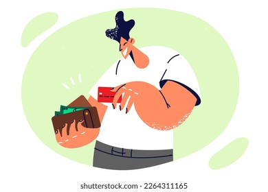 Positive man with wallet filled with banknotes takes out credit card to pay in store after shopping. Guy removes credit card after paying for goods with borrowed money or getting cash from ATM 