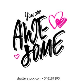 Positive quote 'You are awesome'. Hand lettering with pink hand drawn hearts isolated on white background for love card, Valentine's card or inspirational poster.