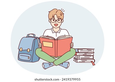 Positive schoolboy sits cross-legged on floor near backpack and stacks of textbooks getting ready for lessons. Delighted boy in glasses looks at camera while reading literature. Flat vector design