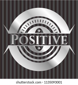 Positive silvery badge