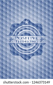 Positive Thinking blue badge with geometric pattern background.