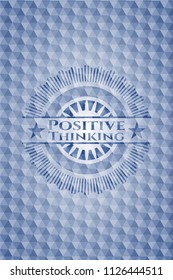 Positive Thinking blue emblem with geometric pattern background.