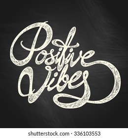 Positive Vibes- hand drawn quote, white on the blackboard background